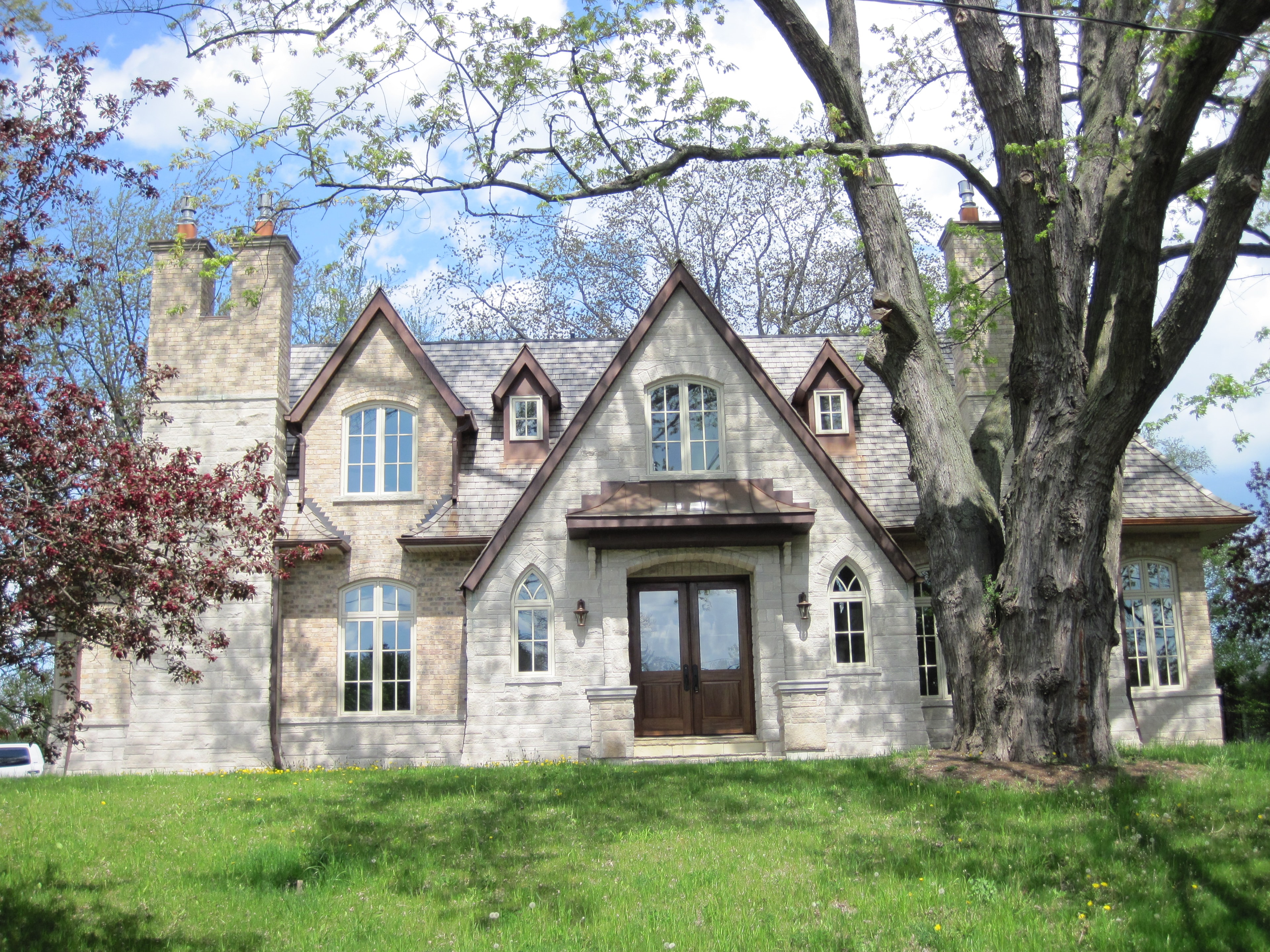 Gothic Revival stone home with pointed dormers